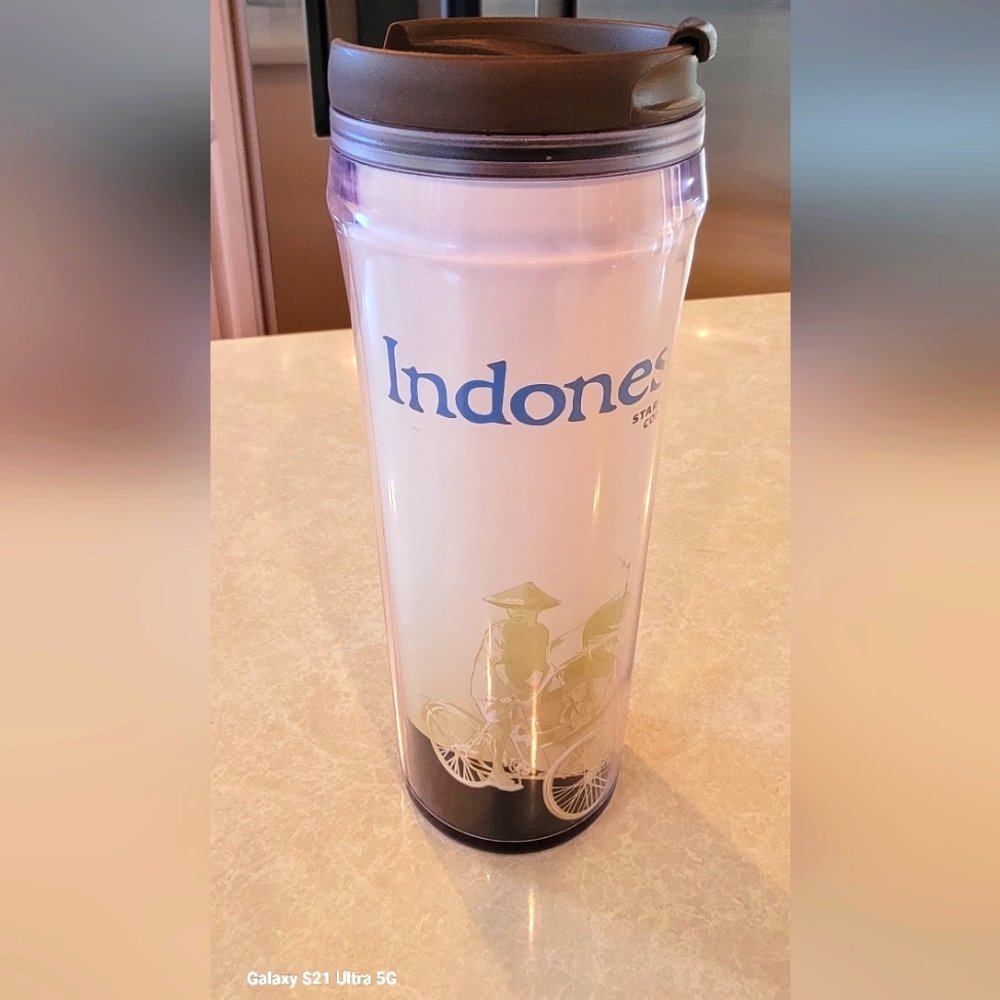 International Starbucks coffee to go cup with lid, from Indonesia. never used